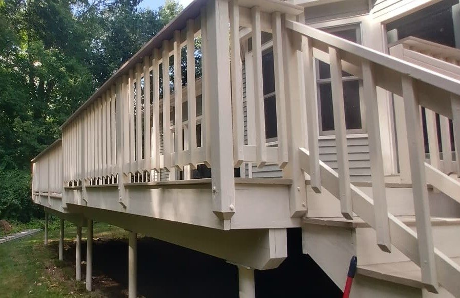 Deck railing after refinishing, fresh and uniform finish
